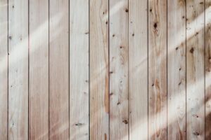 can you paint over stained wood exterior